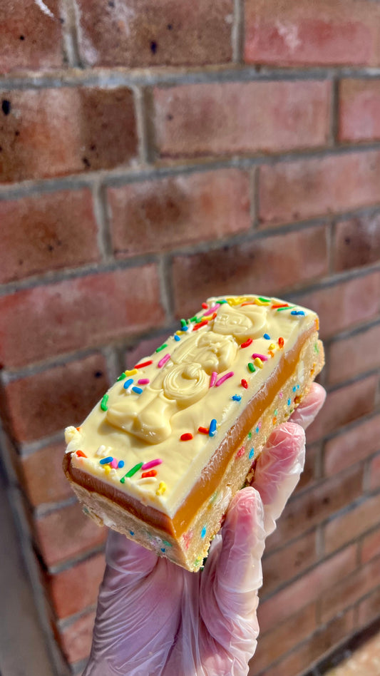 Milkybar Funfetti Millionaires Cookie Slice